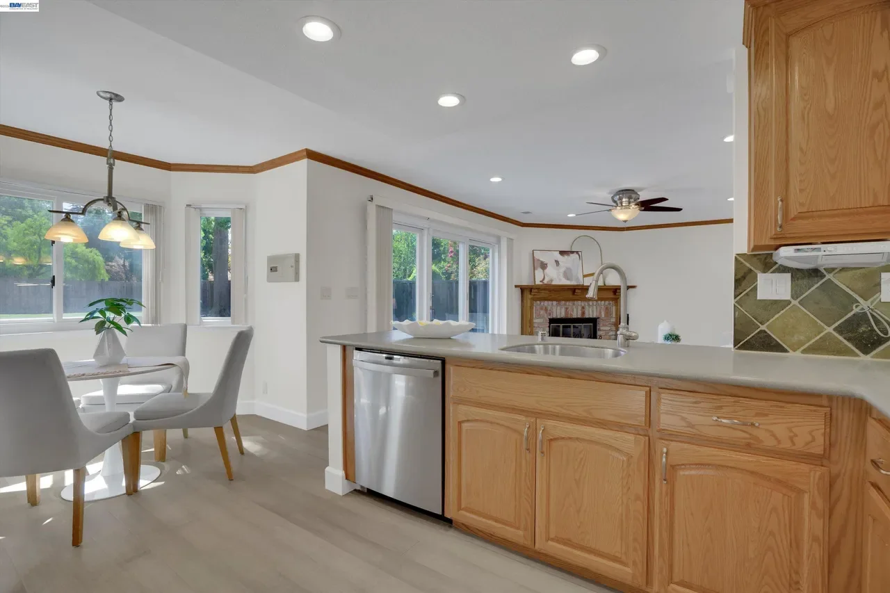 The kitchen opens directly to a casual dining area and the adjacent family room at 19475 Mount Jasper Drive.