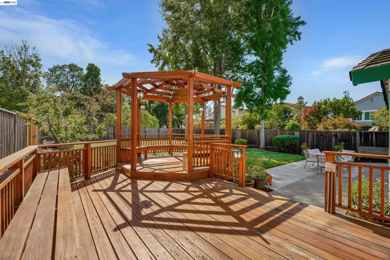The elevated wood deck and gazebo provide multiple outdoor gathering areas at 19475 Mount Jasper Drive.